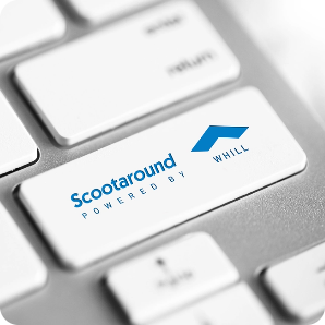 A white keyboard key displays 'Scootaround POWERED BY WHILL' with a blue logo.